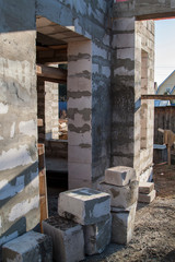 interior of a country house under construction. Site on which the walls are built of gas concrete blocks with wooden formwork