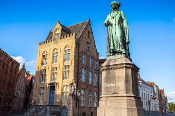 Fototapeta na wymiar Bruges, Belgium - August 17, 2017: Statue of the Flemish painter Jan van Eyck in Bruges.