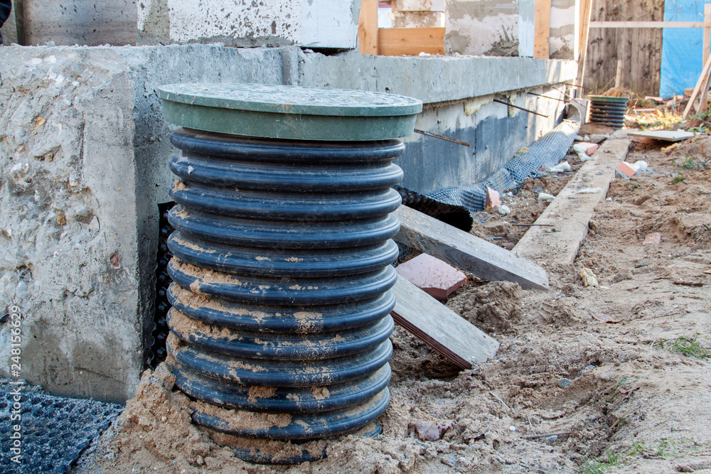 Poster inspection manhole and concrete foundation porches with supporting columns of foam blocks on the per