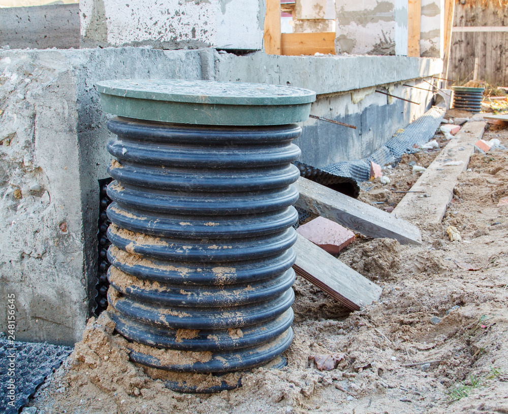 Poster inspection manhole and concrete foundation porches with supporting columns of foam blocks on the per