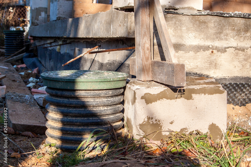 Poster inspection manhole and concrete foundation porches with supporting columns of foam blocks on the per