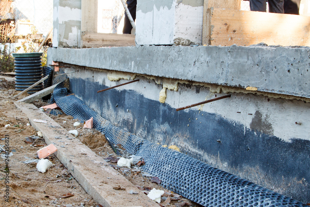 Poster inspection manhole and concrete foundation porches with supporting columns of foam blocks on the per
