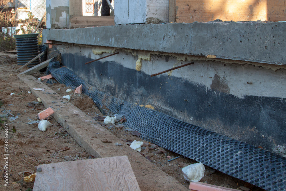 Poster inspection manhole and concrete foundation porches with supporting columns of foam blocks on the per