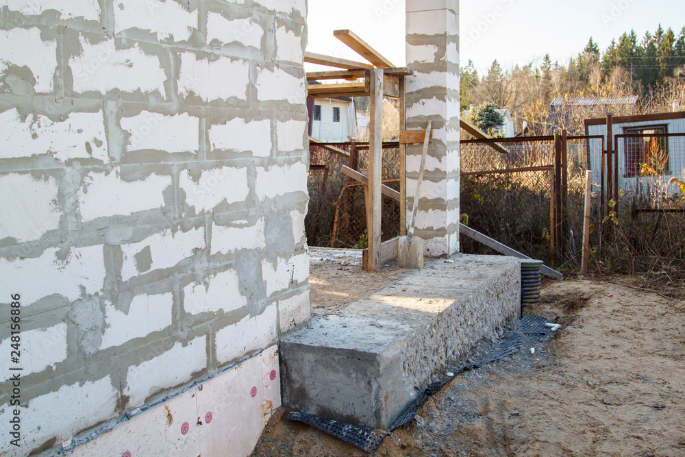 Poster inspection manhole and concrete foundation porches with supporting columns of foam blocks on the per