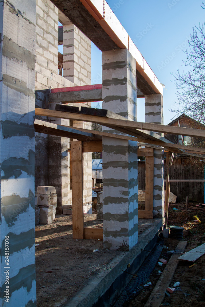 Poster inspection manhole and concrete foundation porches with supporting columns of foam blocks on the per