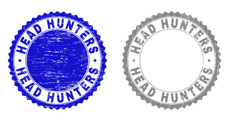 Grunge HEAD HUNTERS stamp seals isolated on a white background. Rosette seals with grunge texture in blue and gray colors. Vector rubber stamp imitation of HEAD HUNTERS caption inside round rosette.