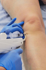 Female doctor doing mesotherapy treatment for pain. Beauty and healthcare.