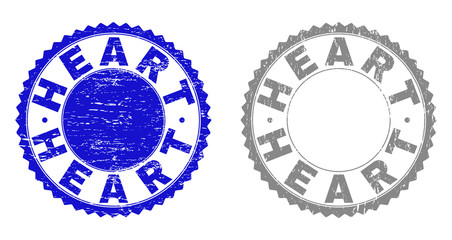 Grunge HEART stamp seals isolated on a white background. Rosette seals with grunge texture in blue and gray colors. Vector rubber stamp imitation of HEART tag inside round rosette.