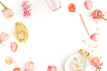 Pastel office table desk with leaves, spring flowers, clipboard and beauty accessories, top view, flat lay. Fashion women office workspace isolated on white background.