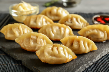 Tasty Japanese gyoza on slate plate