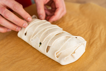 Spinach pie: Italian stromboli with eggs, spinach and mozzarella (Easter pastry)