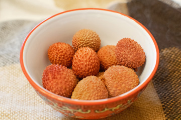 Tropical fruit lychee in the bowl. Fresh lychee. Delicious tropical fruit.