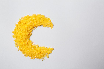 Sea salt in shape of half-moon as symbol of Islam on light background