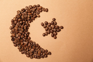 Half-moon and star made of coffee beans as symbol of Islam on color background