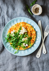 Summer squash frittata with goat cheese and arugula - delicious healthy diet food, breakfast, snack on a gray background, top view