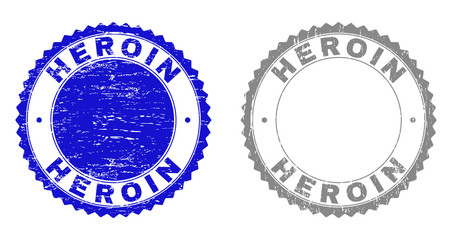 Grunge HEROIN stamp seals isolated on a white background. Rosette seals with grunge texture in blue and gray colors. Vector rubber watermark of HEROIN label inside round rosette.
