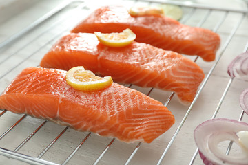 Raw salmon fillet on grill