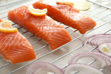 Raw salmon fillet on grill