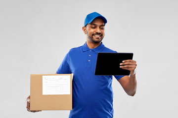 mail service, technology and shipment concept - happy indian delivery man with parcel box and...