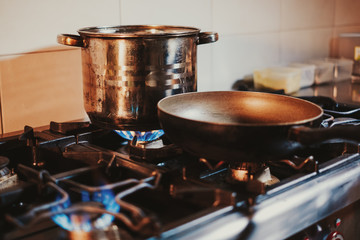 Frying pan heating on the kitchen stove