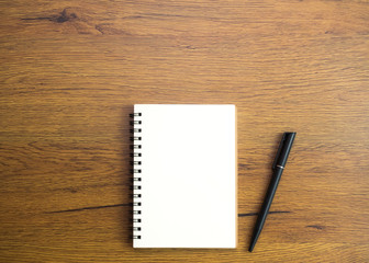 Young unrecognisable female college student in class, taking notes and using highlighter. Focused student in classroom. Authentic Education concept.