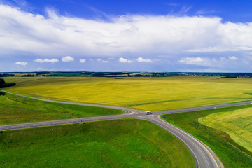 Crossroads in green meadow