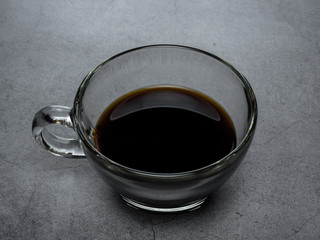 Coffee cup and beans on old kitchen table. Top view with copyspace for your tex