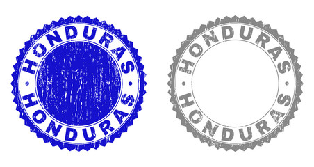 Grunge HONDURAS stamp seals isolated on a white background. Rosette seals with grunge texture in blue and gray colors. Vector rubber stamp imitation of HONDURAS title inside round rosette.