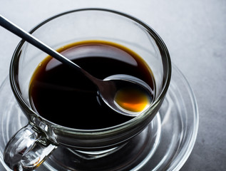 Coffee cup and beans on old kitchen table. Top view with copyspace for your tex