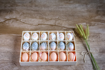 Easter eggs hand painted inside a gift box, photo for advertising use.