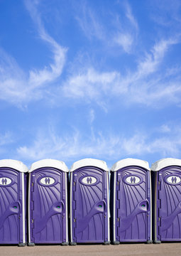 Row of Portable Plastic Toilets