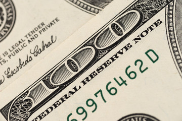 Blurred background from banknotes of dollars close up. Dollars Closeup Concept. 