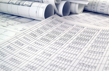 Photo numbers in the table on a sheet of paper and project drawings
