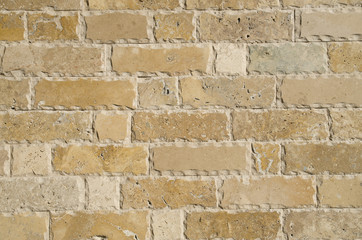 New relief limestone cladding on wall closeup