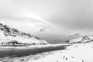 frozen sea and snow-covered mountains, Lofoten Islands, Norway