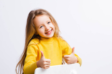 Cute girl 4-5 year old posing in studio. Original, square photo with space for text.
