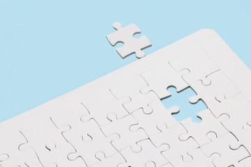 Missing jigsaw puzzle on blue background