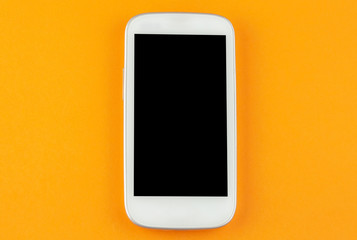 smart phone on yellow background with copy space