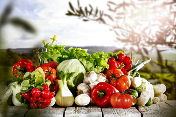 Vegetables in the basket box  chest on the wooden table background