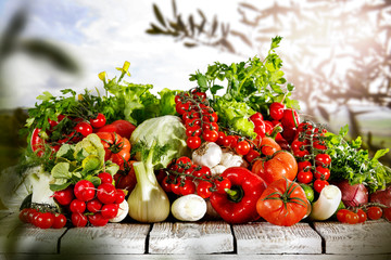 Vegetables in the basket box  chest on the wooden table background