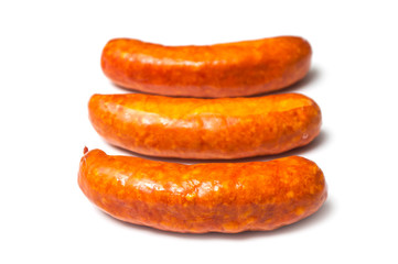 Closeup of smoked sausage on white background