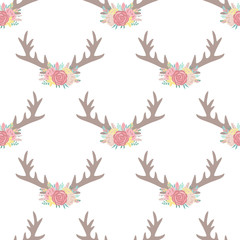 Seamless boho pattern. Vector image on national American motifs. Illustration of deer horns with feathers and flowers. For print, background, textile, wrapping paper, holiday, birthday,  baby shower