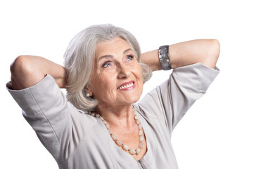 Portrait of beautiful senior woman, posing against white background