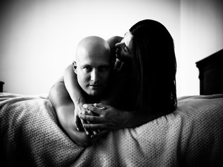 Young beautiful couple makes love at home