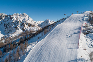 Skiers on the ski slope, ski resort in Valtellina.