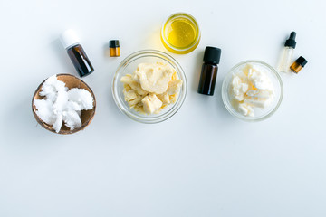 diy body butter with ingrdients on concrete background