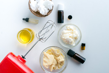 diy body butter with ingrdients on concrete background