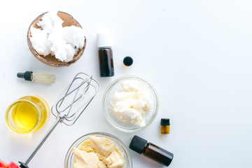 diy body butter with ingrdients on concrete background