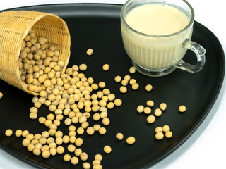 Soy milk and soybeans in a plate, Isolated on white background