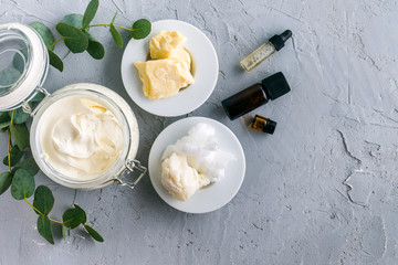 diy body butter with ingrdients on concrete background